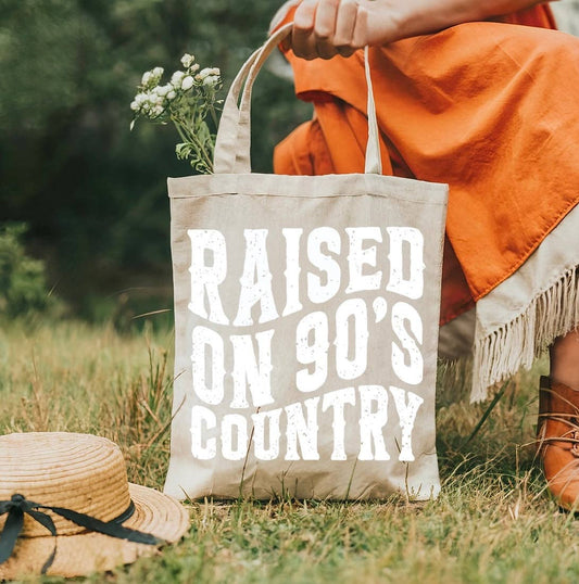 Raised on 90’s country tote bag